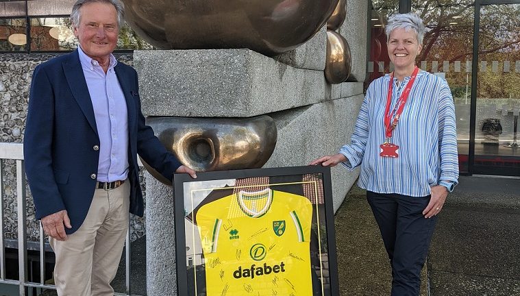 Alan Boswell holding Norwich City shirt